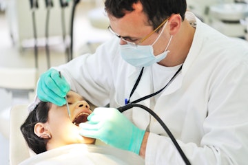 dentist carrying out checkup on patient