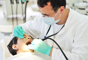 dentist carrying out checkup on patient
