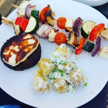 marinated chicken skewers on white plate
